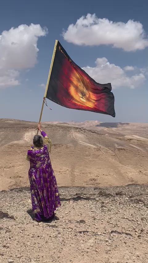 Sacred Fire Lion of Judah silk worship flag raised in worship over the Negev desert in Israel